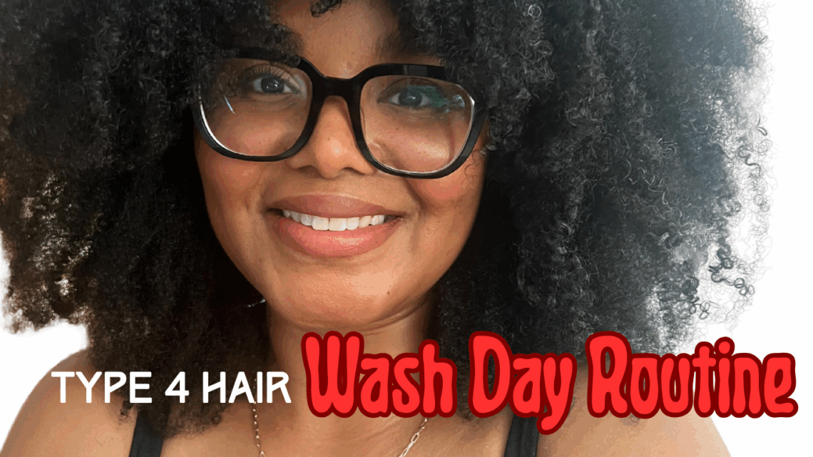 Woman with curly hair and glasses after completing her wash day routine for type 4 hair.