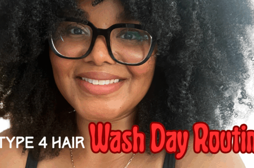 Woman with curly hair and glasses after completing her wash day routine for type 4 hair.