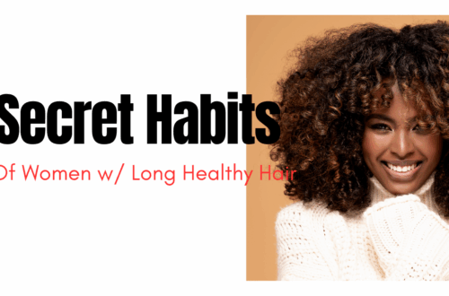 Black woman with long curly healthy hair smiling in a white sweater with a bronze colored background